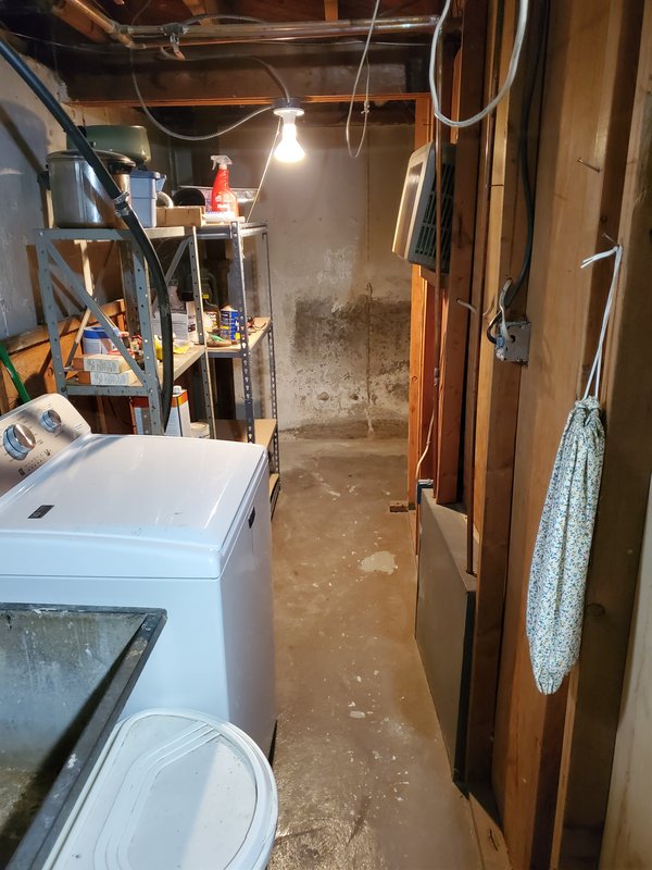 Basement floor cleared after the old oil tank was removed
