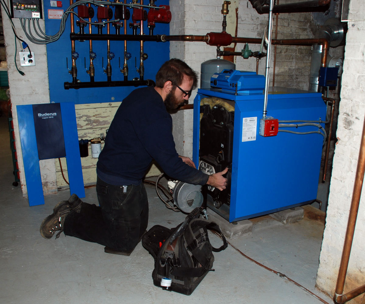 Mark from Dole Service servicing a Buderus boiler in a Long Island home