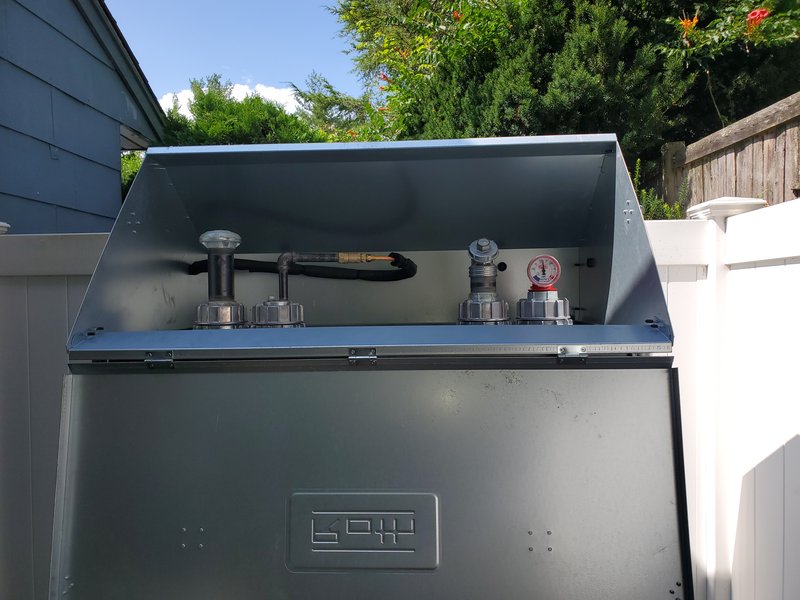 Roth outdoor oil tank with the lid open showing fill, vent and gauge