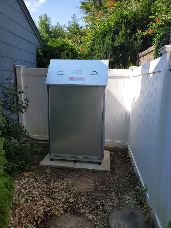 New Roth double-wall oil tank installed outdoors on a concrete pad